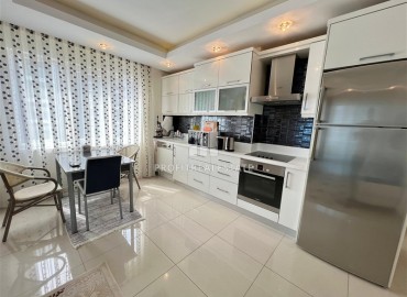 Симпатичная двухкомнатная квартира, 70м², с видом на горы в 200м от моря в Махмутларе, Алания ID-19088 фото-5
