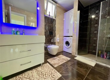Симпатичная двухкомнатная квартира, 70м², с видом на горы в 200м от моря в Махмутларе, Алания ID-19088 фото-9