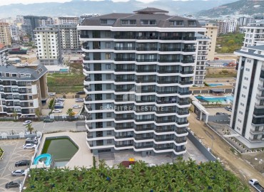 Комфортабельная квартира с одной спальней, 55м², в новостройке премиум класса в центре Махмутлара, Алания ID-19096 фото-1