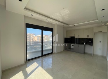 Комфортабельная квартира с одной спальней, 55м², в новостройке премиум класса в центре Махмутлара, Алания ID-19096 фото-2