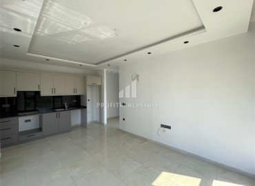 Комфортабельная квартира с одной спальней, 55м², в новостройке премиум класса в центре Махмутлара, Алания ID-19096 фото-3