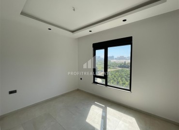 Комфортабельная квартира с одной спальней, 55м², в новостройке премиум класса в центре Махмутлара, Алания ID-19096 фото-6