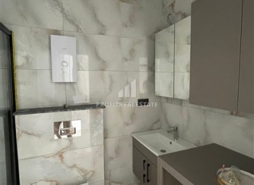 Комфортабельная квартира с одной спальней, 55м², в новостройке премиум класса в центре Махмутлара, Алания ID-19096 фото-7