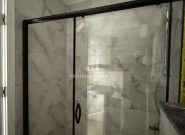 Комфортабельная квартира с одной спальней, 55м², в новостройке премиум класса в центре Махмутлара, Алания ID-19096 фото-8