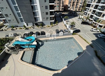 Комфортабельная квартира с одной спальней, 55м², в новостройке премиум класса в центре Махмутлара, Алания ID-19096 фото-10