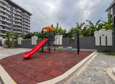 Комфортабельная квартира с одной спальней, 55м², в новостройке премиум класса в центре Махмутлара, Алания ID-19096 фото-16