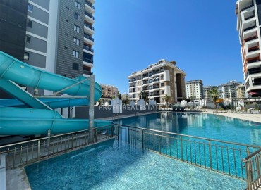 Комфортабельная квартира с одной спальней, 55м², в новостройке премиум класса в центре Махмутлара, Алания ID-19096 фото-27