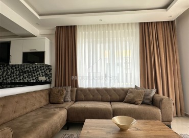 Элегантные апартаменты с одной спальней, 50м², в резиденции с хорошей инфраструктурой у моря в Махмутларе, Алания ID-19099 фото-5