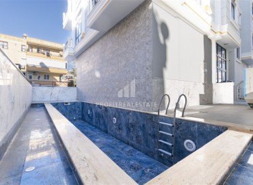 Элегантная двухкомнатная квартира, 72м², в новостройке с бассейном в центре Алании, 500м от пляжа Клеопатры ID-19100 фото-24