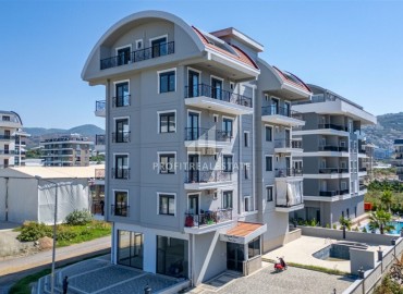 Компактная квартира 1+1, 44м², в новом недорогом комплексе с бассейном в Каргыджаке, Алания, по привлекательной цене ID-19102 фото-1