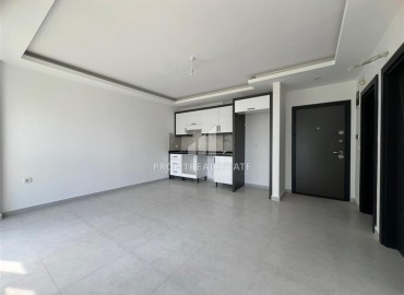 Новая двухкомнатная квартира, 52м², с чистовой отделкой в комплексе с инфраструктурой в Авсалларе, Алания ID-19104 фото-1