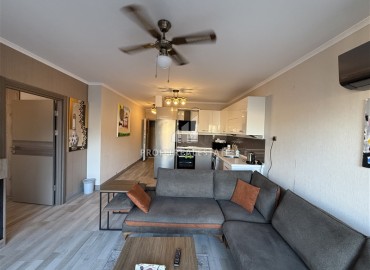 Меблированная двухкомнатная квартира, 55м², в недорогом комплексе в 700м от моря в районе Оба, Алания ID-19112 фото-2