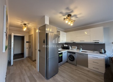 Меблированная двухкомнатная квартира, 55м², в недорогом комплексе в 700м от моря в районе Оба, Алания ID-19112 фото-5