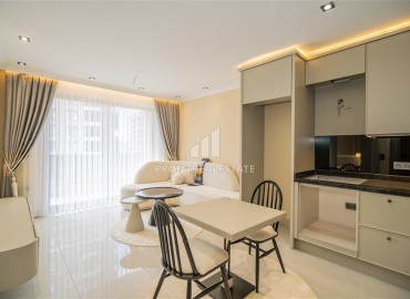 Элегантная двухкомнатная квартира, 42м², в элитной резиденции в 850м от моря в Махмутларе, Алания ID-19113 фото-1