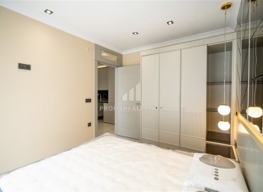 Элегантная двухкомнатная квартира, 42м², в элитной резиденции в 850м от моря в Махмутларе, Алания ID-19113 фото-12