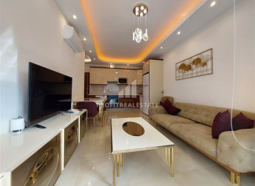 Элегантные апартаменты с одной спальней, 70м², в элитном комплексе, в 400 метрах от моря в Махмутларе, Алания ID-19114 фото-2