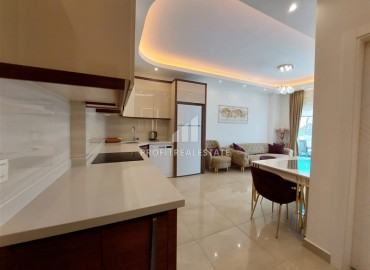 Элегантные апартаменты с одной спальней, 70м², в элитном комплексе, в 400 метрах от моря в Махмутларе, Алания ID-19114 фото-8