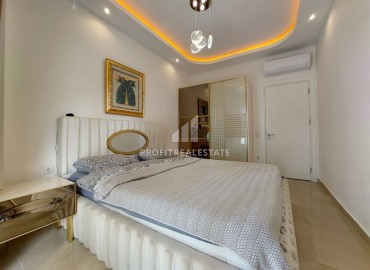 Элегантные апартаменты с одной спальней, 70м², в элитном комплексе, в 400 метрах от моря в Махмутларе, Алания ID-19114 фото-10