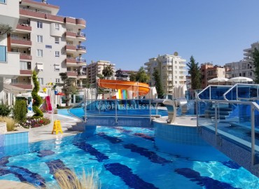 Элегантные апартаменты с одной спальней, 70м², в элитном комплексе, в 400 метрах от моря в Махмутларе, Алания ID-19114 фото-16