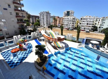Элегантные апартаменты с одной спальней, 70м², в элитном комплексе, в 400 метрах от моря в Махмутларе, Алания ID-19114 фото-28