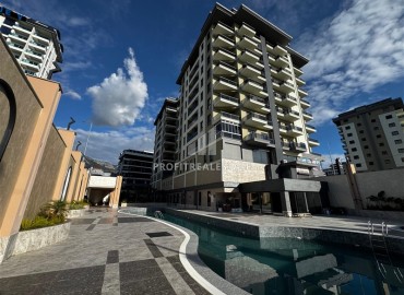 Комфортабельная двухкомнатная квартира, 60м², в комплексе с отельной инфраструктурой, у моря в Махмутларе, Алания ID-19122 фото-1