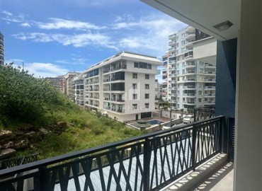 Элегантная квартира с одной спальней, 56м² в элитном комплексе с отличной локацией в Махмутларе, Алания ID-19133 фото-8