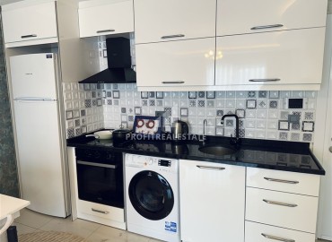 Стильные апартаменты с одной спальней, 68м², в комплексе с бассейном с отличной локацией в 400м от моря в Махмутларе, Алания ID-19147 фото-11