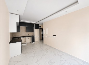 Апартаменты с одной спальней, 55м² с чистовой отделкой в комфортабельном комплексе, в центре Алании, 150м до моря ID-19154 фото-2
