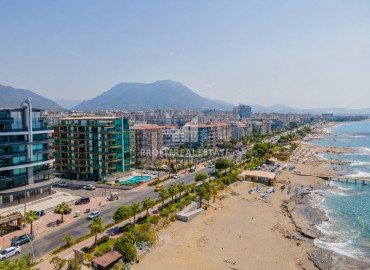 Видовая стильная квартира 1+1, 65м², в элитном комплексе на первой береговой линии в районе Тосмур, Алания ID-18497 фото-1