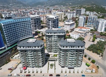 Апартаменты с одной спальней, 55м², в новом фешенебельном комплексе в районе Тосмур, Алания, в 100м от моря ID-19183 фото-1