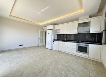 Новая видовая квартира с двумя спальнями, 70м², с отличной локацией в центре Махмутлара, Алания, в 100м от моря ID-19186 фото-4