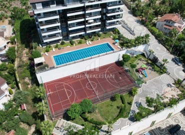 Элегантная видовая двухкомнатная квартира, 64м², в элитном комплексе района Каргыджак, Алания ID-19190 фото-18