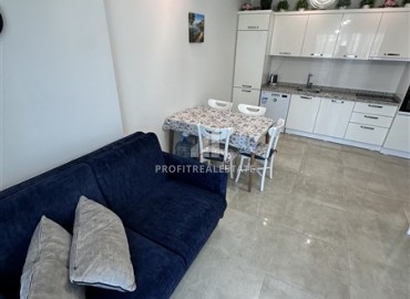 Видовые меблированные апартаменты 1+1, 65м², на высоком этаже в элитном комплексе в 500м от моря в Махмутларе, Алания ID-19194 фото-7