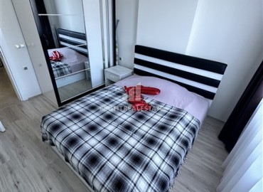 Видовые меблированные апартаменты 1+1, 65м², на высоком этаже в элитном комплексе в 500м от моря в Махмутларе, Алания ID-19194 фото-15