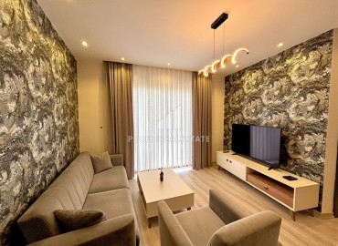 Элегантные двухкомнатные апартаменты, 55м², в элитном комплексе в 500м от моря в Махмутларе, Алания ID-19195 фото-2