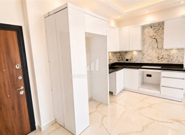Апартаменты с одной спальней, 57м², в новой комфортабельной резиденции в 150м от моря в районе Кестель, Алания ID-19201 фото-3