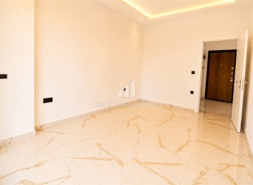 Апартаменты с одной спальней, 57м², в новой комфортабельной резиденции в 150м от моря в районе Кестель, Алания ID-19201 фото-9