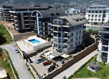 Стильная квартира с одной спальней, 55м², в современном комплексе с комфортной инфраструктурой в районе Оба, Алания ID-19205 фото-1