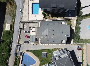 Стильная квартира с одной спальней, 55м², в современном комплексе с комфортной инфраструктурой в районе Оба, Алания ID-19205 фото-18