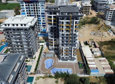 Двухкомнатная квартира, 55м², в комфортабельной новостройке с инфраструктурой в Махмутларе, Алания, в 500м от моря ID-19209 фото-1