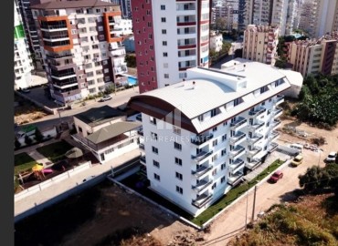 Уютная квартира с одной спальней, 55м², в комплексе с инфраструктурой, в 700м от моря в Махмутларе, Алания ID-19214 фото-1