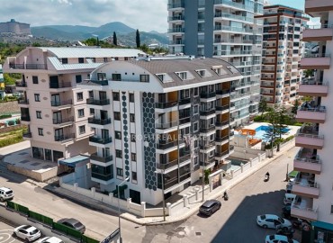 Меблированная двухкомнатная квартира, 55м², в комплексе с инфраструктурой в районе Махмутлар, Алания ID-19219 фото-1