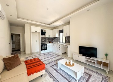 Меблированная двухкомнатная квартира, 55м², в комплексе с инфраструктурой в районе Махмутлар, Алания ID-19219 фото-2