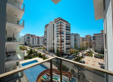 Меблированная двухкомнатная квартира, 55м², в комплексе с инфраструктурой в районе Махмутлар, Алания ID-19219 фото-10