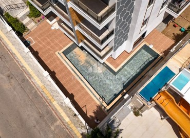 Меблированная двухкомнатная квартира, 55м², в комплексе с инфраструктурой в районе Махмутлар, Алания ID-19219 фото-11