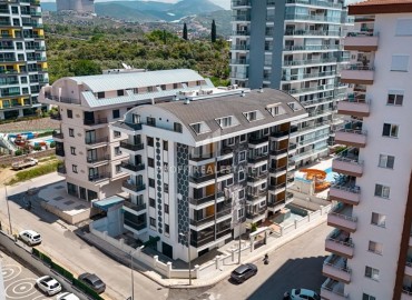Меблированная двухкомнатная квартира, 55м², в комплексе с инфраструктурой в районе Махмутлар, Алания ID-19219 фото-20