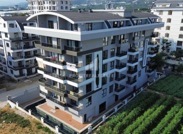 Двухкомнатные апартаменты, 55м², с чистовой отделкой в резиденции премиум класса в Махмутларе, Алания ID-19221 фото-1
