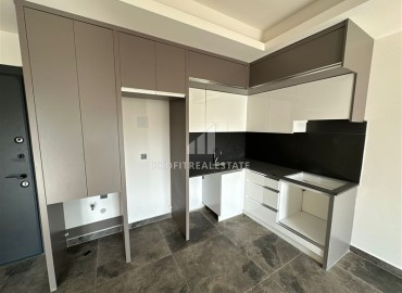 Двухкомнатные апартаменты, 55м², с чистовой отделкой в резиденции премиум класса в Махмутларе, Алания ID-19221 фото-4