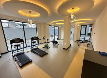 Двухкомнатные апартаменты, 55м², с чистовой отделкой в резиденции премиум класса в Махмутларе, Алания ID-19221 фото-19