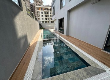 Двухкомнатные апартаменты, 55м², с чистовой отделкой в резиденции премиум класса в Махмутларе, Алания ID-19221 фото-22